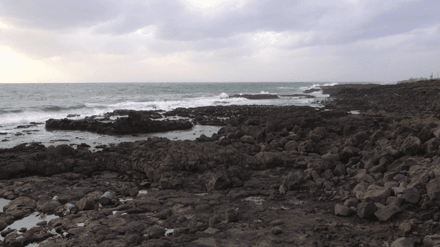 Rocky shoreline with waves crashing