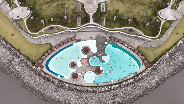 Saltwater pool in park where people are playing