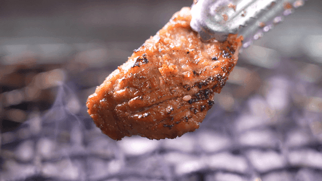 Grilled marinated pork ribs on barbecue grill