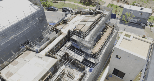 Construction site with scaffolding and workers