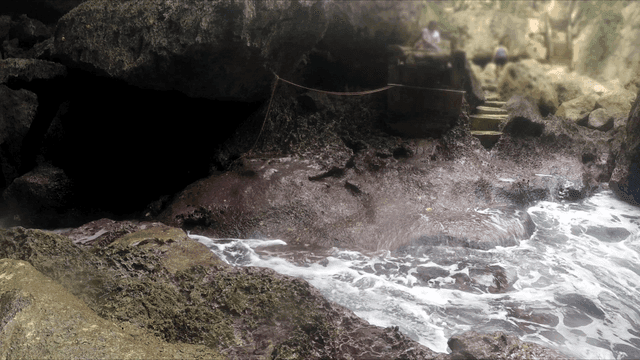 Waves crashing against rocky shore