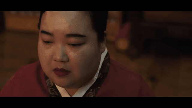 Traditional Korean fan and woman in hanbok