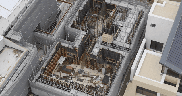 Construction site with workers and scaffolding