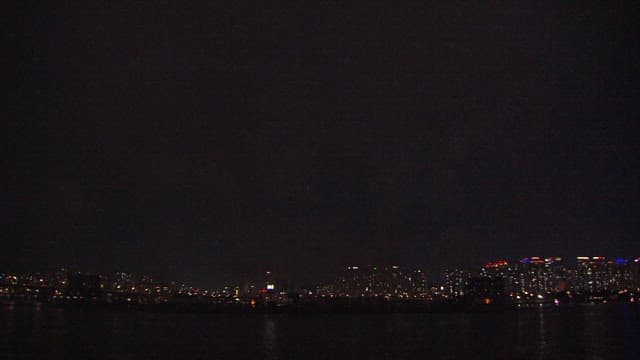 Dazzling fireworks display over the cityscape at night