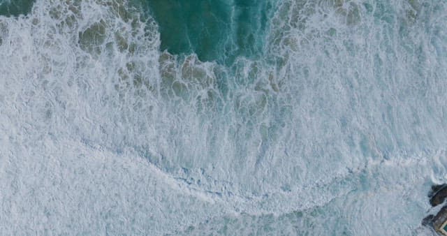 Overhead View of Coastalside with Turbulent Sea