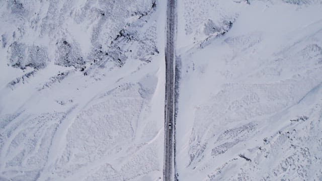 Car driving on a snowy road