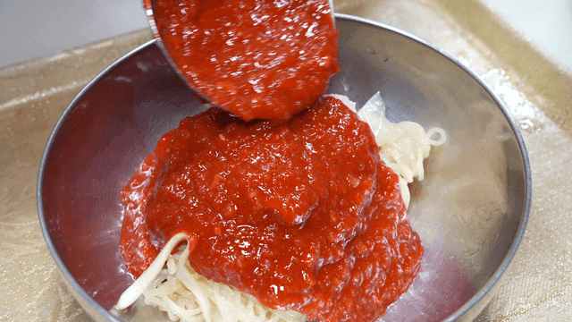 Cold bibim milmyeon with spicy seasoning