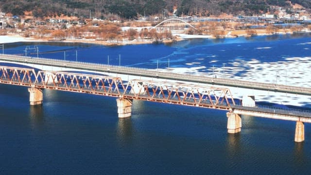 Bridges over a Frozen River in Winter