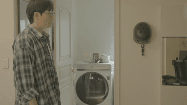 Man seeing woman off as she leaves home