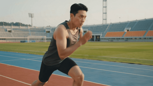 Runner preparing and running on track