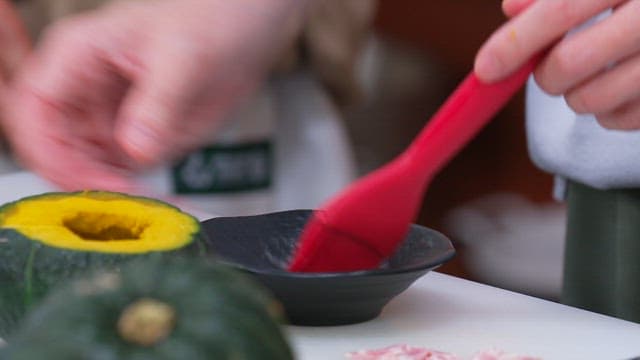 Applying Sauce with a Brush on a Hollowed-out Pumpkin