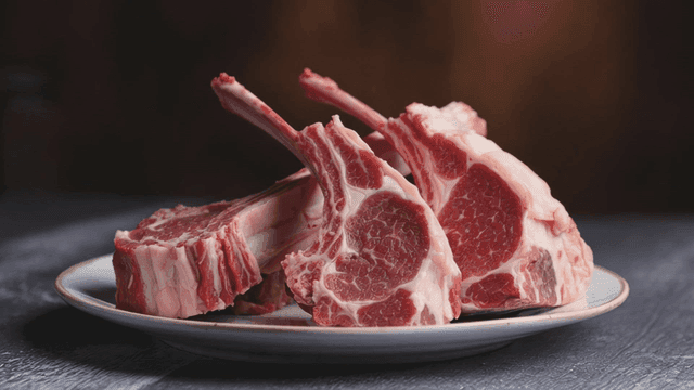 Raw lamb chops on a plate