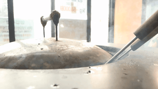 Steam rising from a cooking pot lid