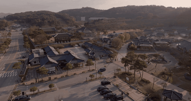 Hanok village at sunset surrounded by mountains
