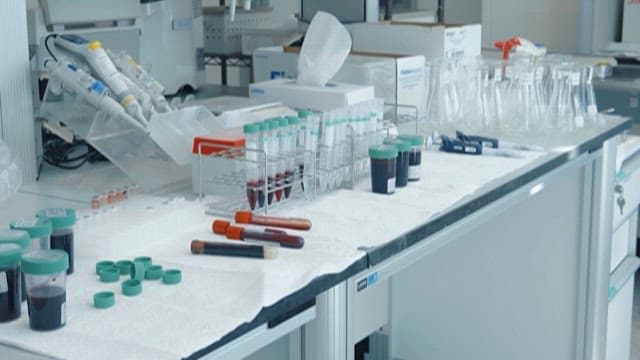 Laboratory Technician Handling Blood Samples