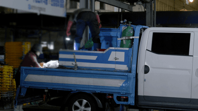 Merchants taking creations out of truck