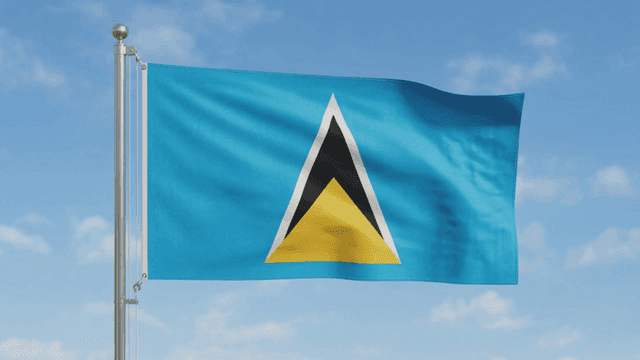 Saint Lucia flag fluttering against clear sky