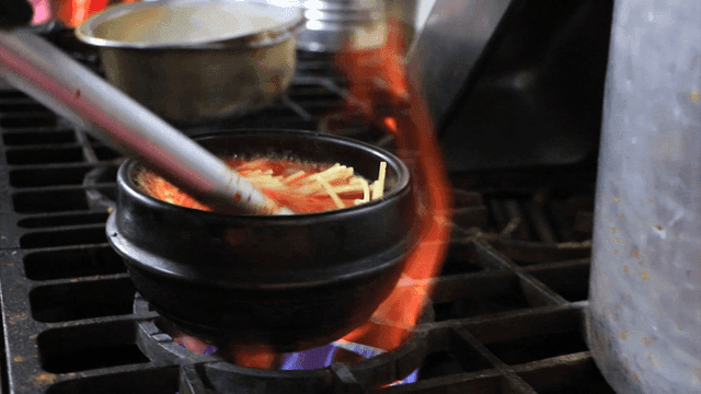 Soft bean curd jjigae being prepared in an hot pot