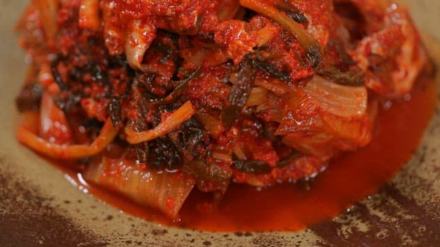 Appetizing and spicy kimchi with large-eyed herring on a plate