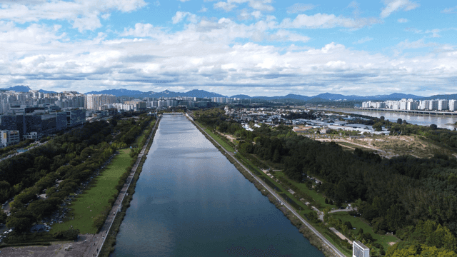 River cutting through city landscape.