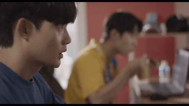 Two friends playing games and eating Ramyeon together