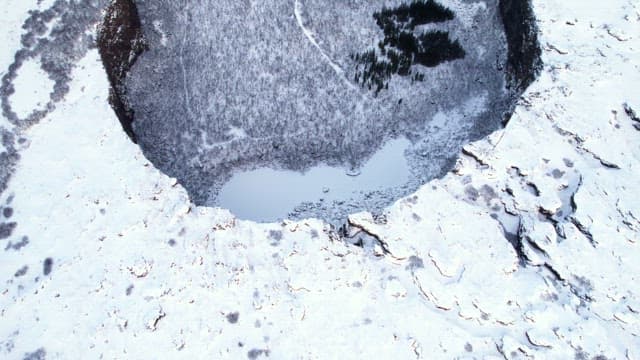 Snow-covered landscape with cliffs
