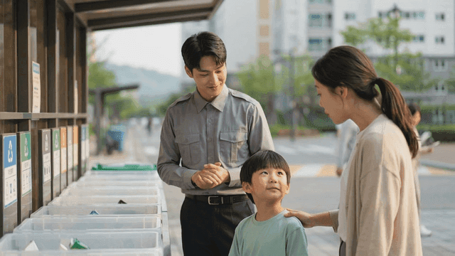 Security guard explaining how to separate recyclables to child