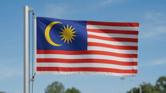 Malaysian flag fluttering in clear sky