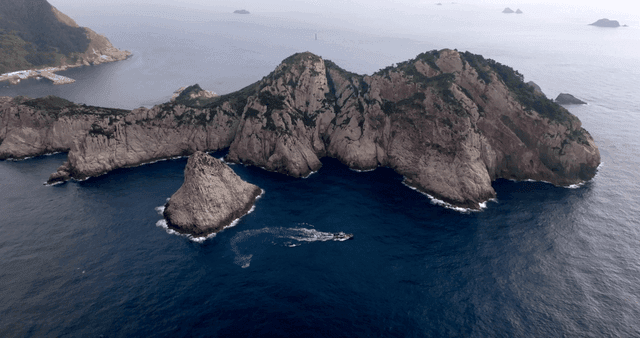 A scenic view of rocky islands and sea