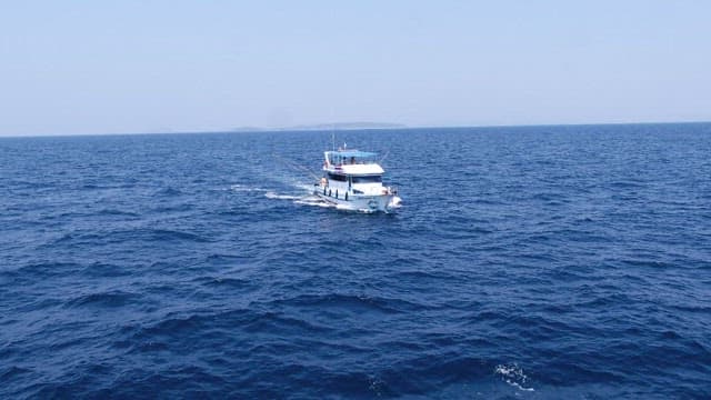 A boat sailing on the open sea