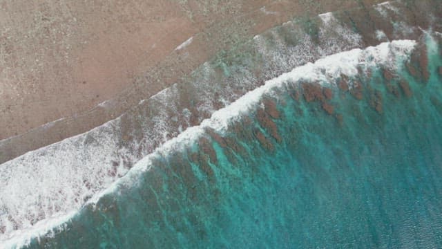 Waves crashing on a sandy beach