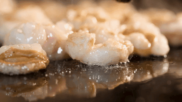 Sizzling beef intestines on hot grill