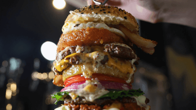 Giant burger loaded with various toppings