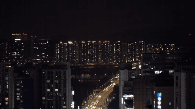 Night view of a city with lit buildings