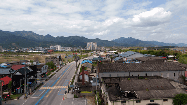 Quiet village road with mountains