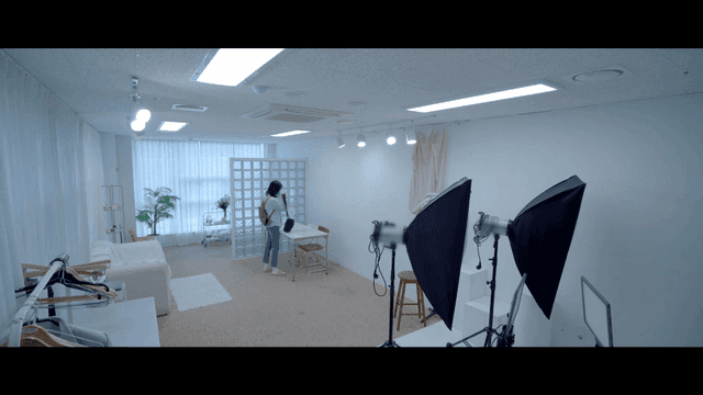 Woman entering bright studio