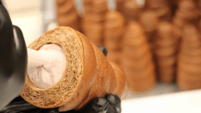 Cream being filled into a bread