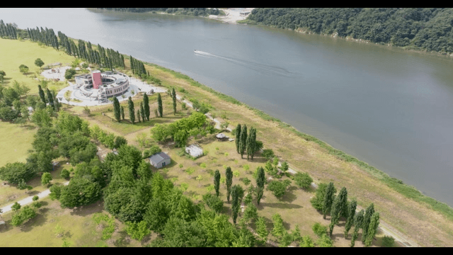 Scenic riverside with a modern building