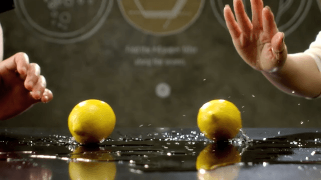 Lemons rolling over a shiny surface