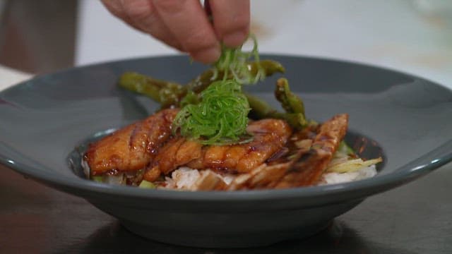 Plate of hairtail rice topped with green onions