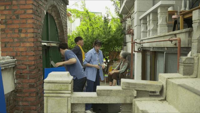 Family moving things in the yard