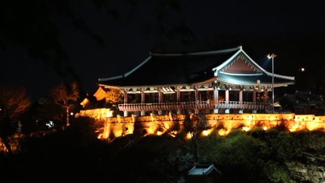 Illuminated traditional Korean building at night