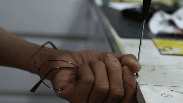 Tightening a screw on eyeglasses