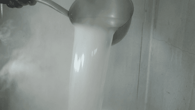 Milky broth poured into pot