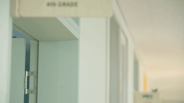 School hallway with classroom grade signs