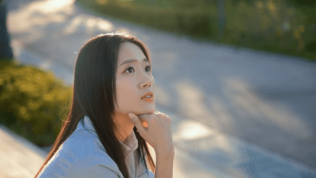 Woman sitting outdoors in the sunlight