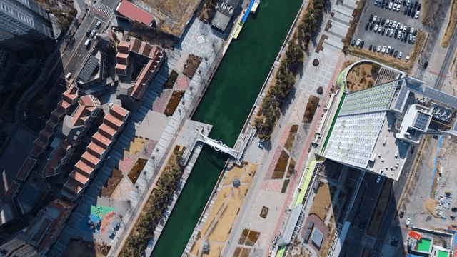 Aerial view of a modern city with a canal