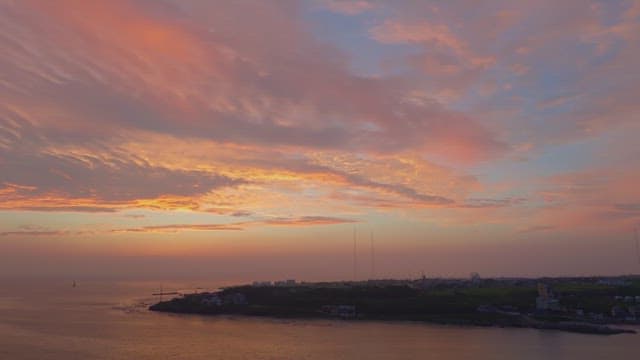 Serene coastal town at sunset