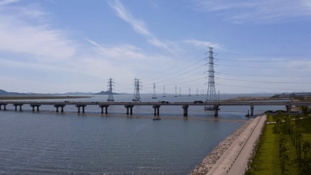 Bridge and cars over the blue river