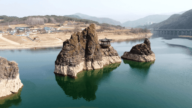 Traditional pavilion on rocky island
